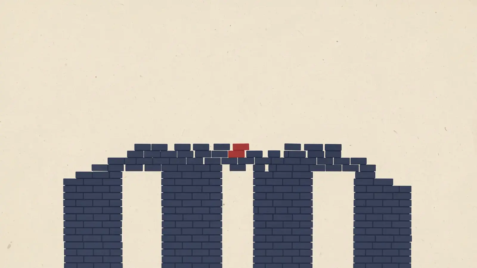 Several stacks of dark blue bricks of different heights joined by an arch of bricks across the top, with one red brick at the highest point.